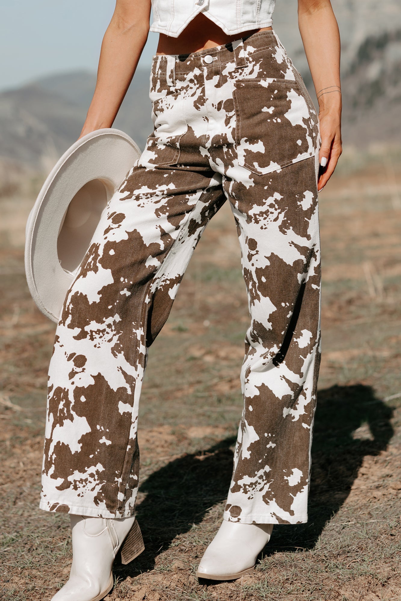 Cowboy Up Cow Print Pants (White/Brown)